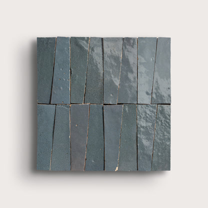 Set of zellige tiles arranged in a pattern on a light gray background