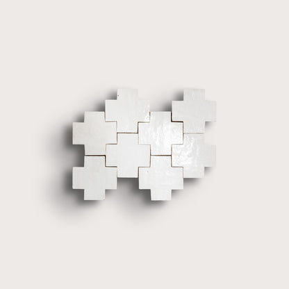 white zellige tile with geometric design on a white background