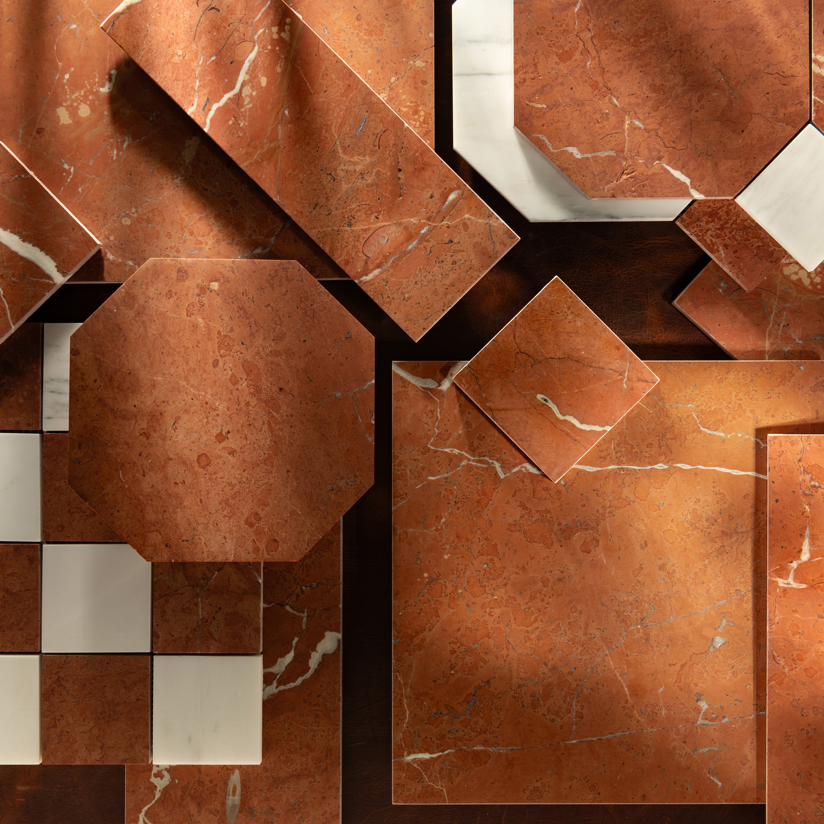 Pattern of brown and beige marble tiles with a geometric design