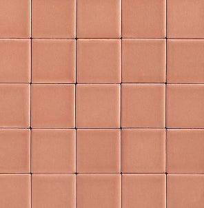 A close-up of square terracotta ceramic tiles arranged in a grid pattern, showing a warm reddish-brown color with subtle grout lines.