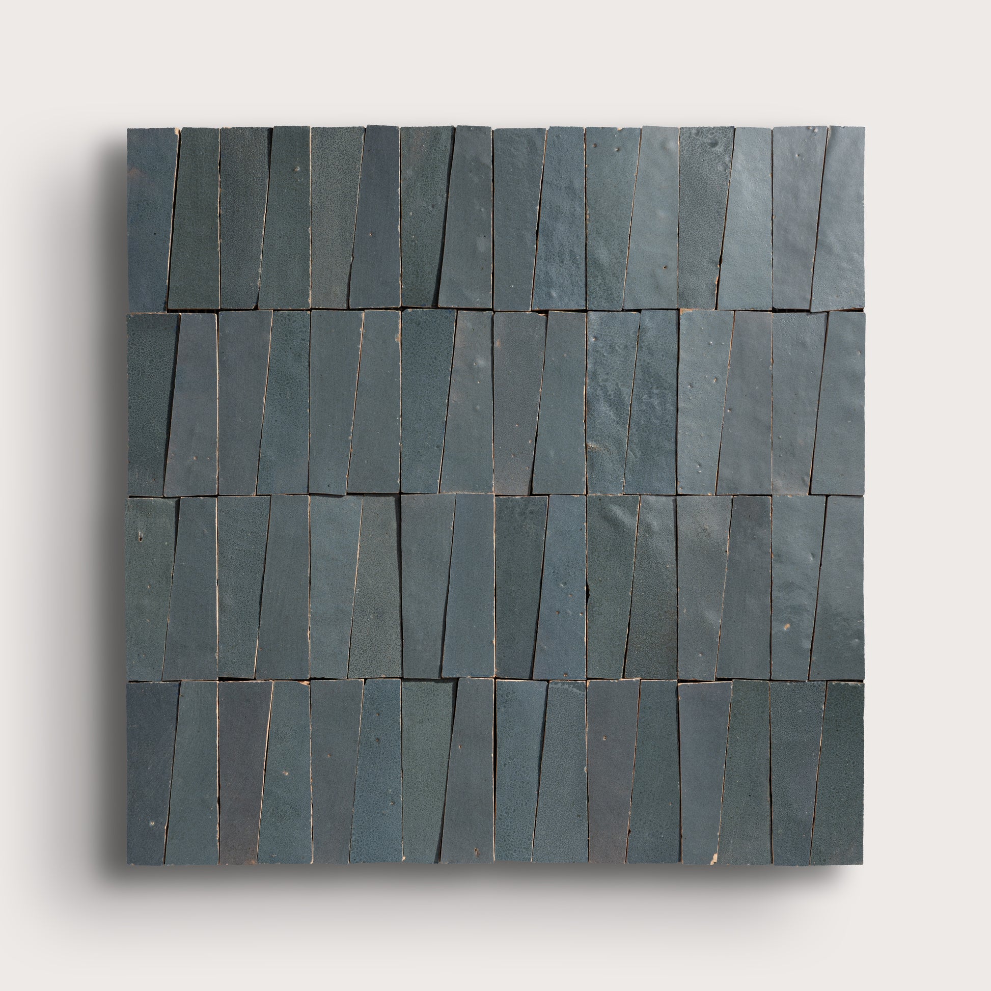 Set of zellige tiles arranged in a pattern on a light gray background