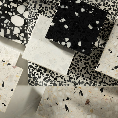 Collection of terrazzo tiles with various patterns and colors 
