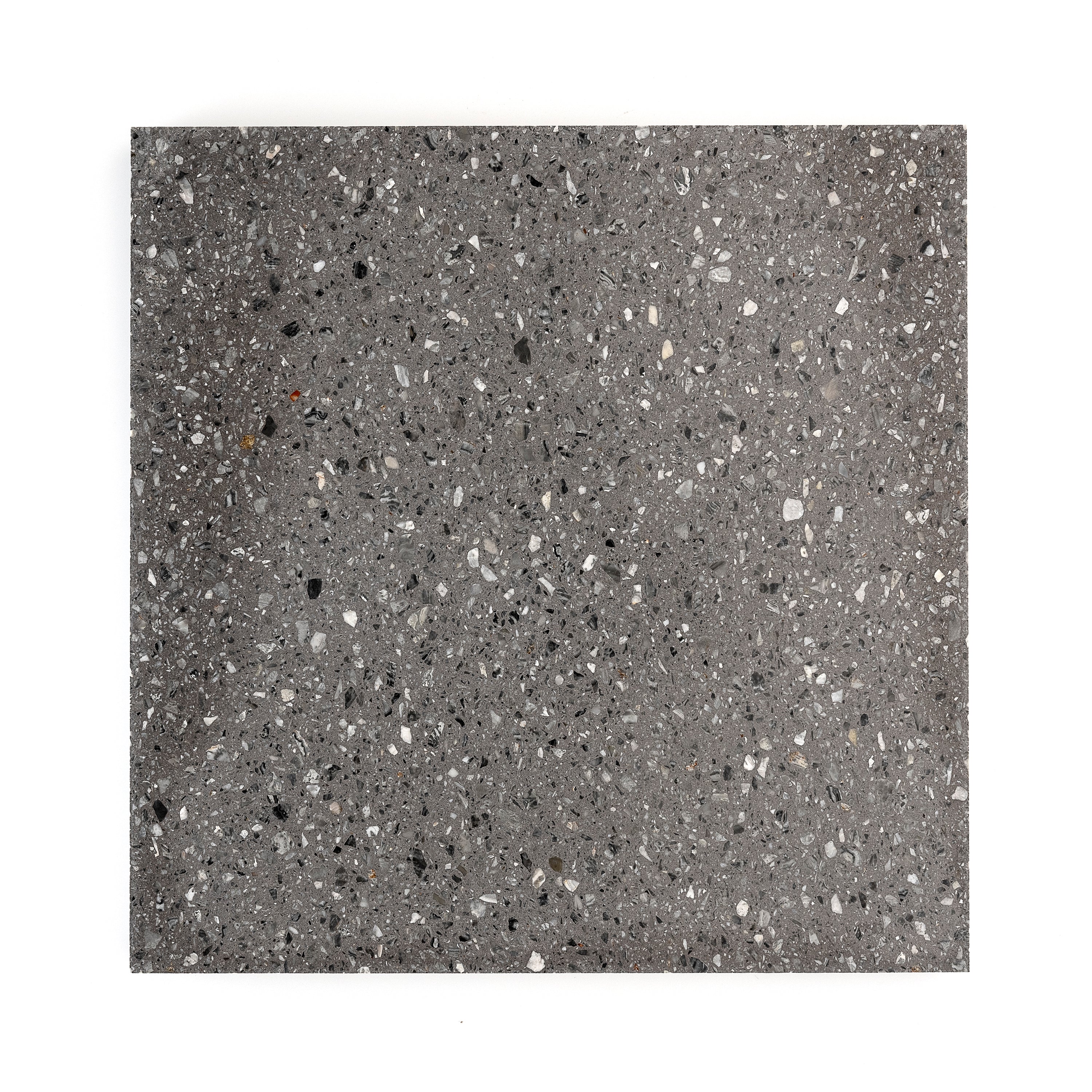 Beautiful terrazzo mosaic in shades of grey and white on a bathroom wall