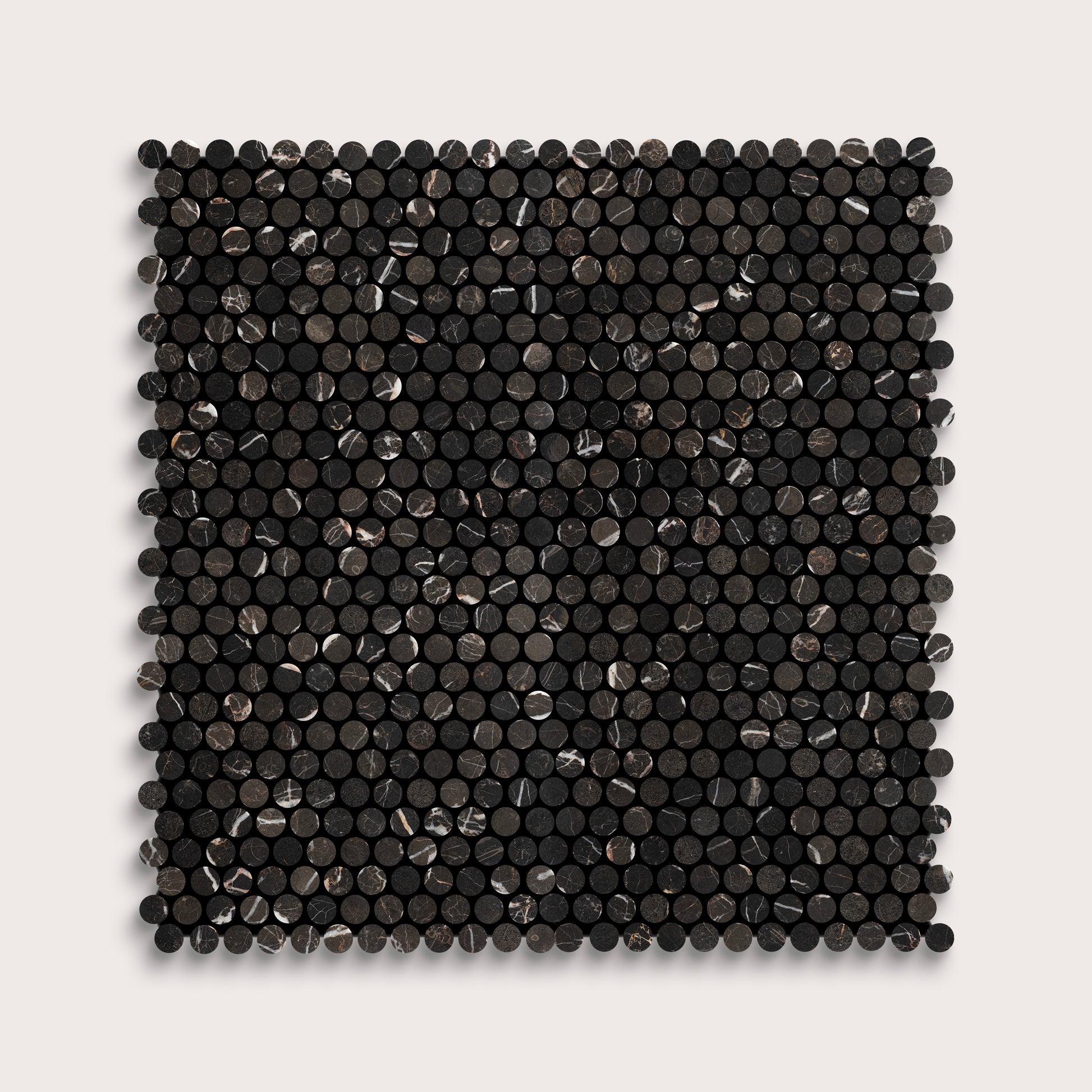 Square marble tile with black circular pattern on a light gray background