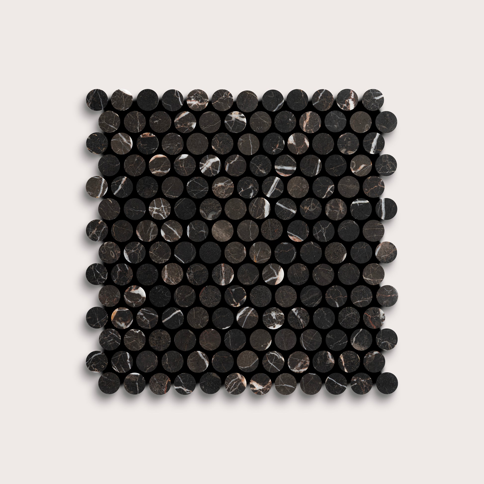 Square arrangement of black circular marble tiles on a light gray background
