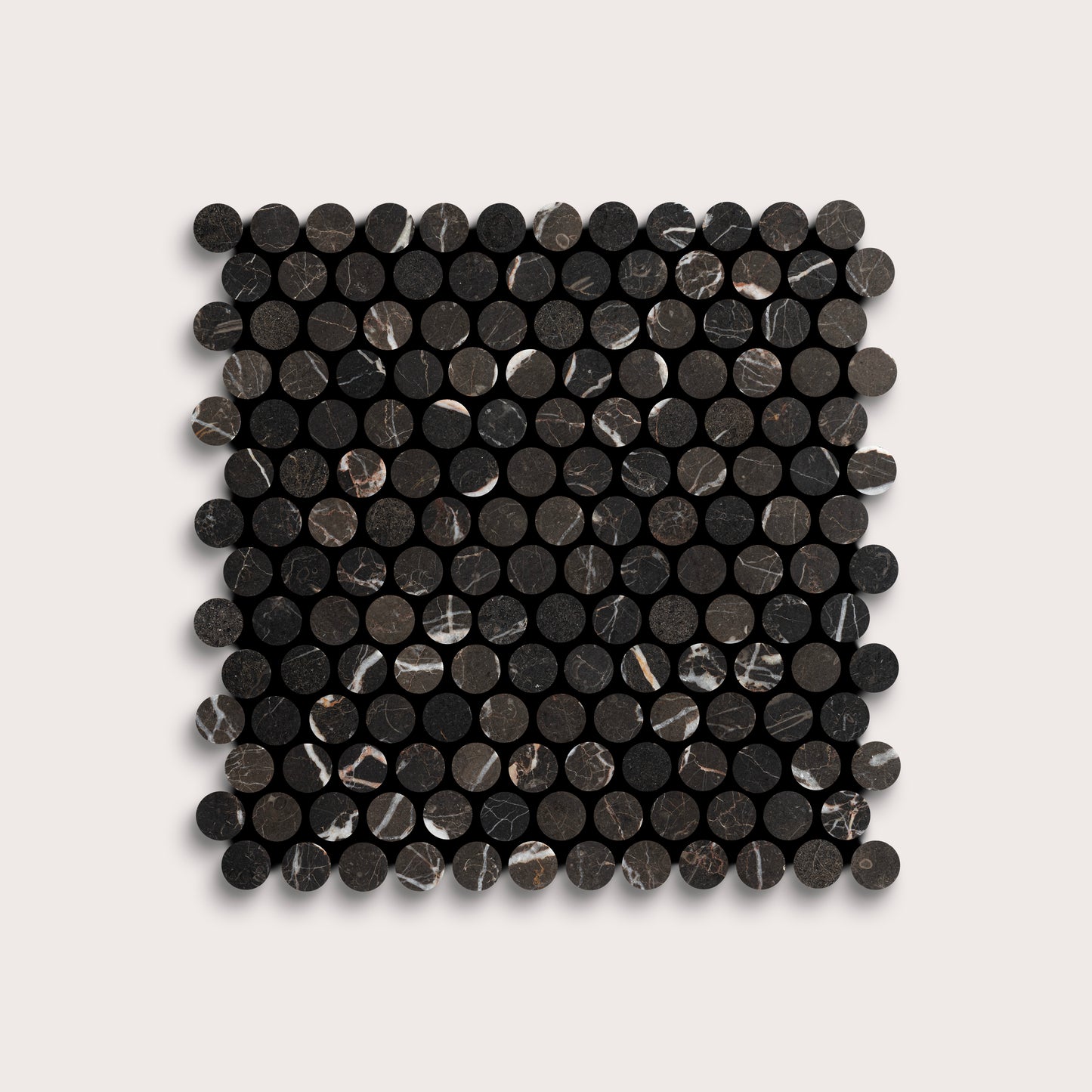Square arrangement of black circular marble tiles on a light gray background