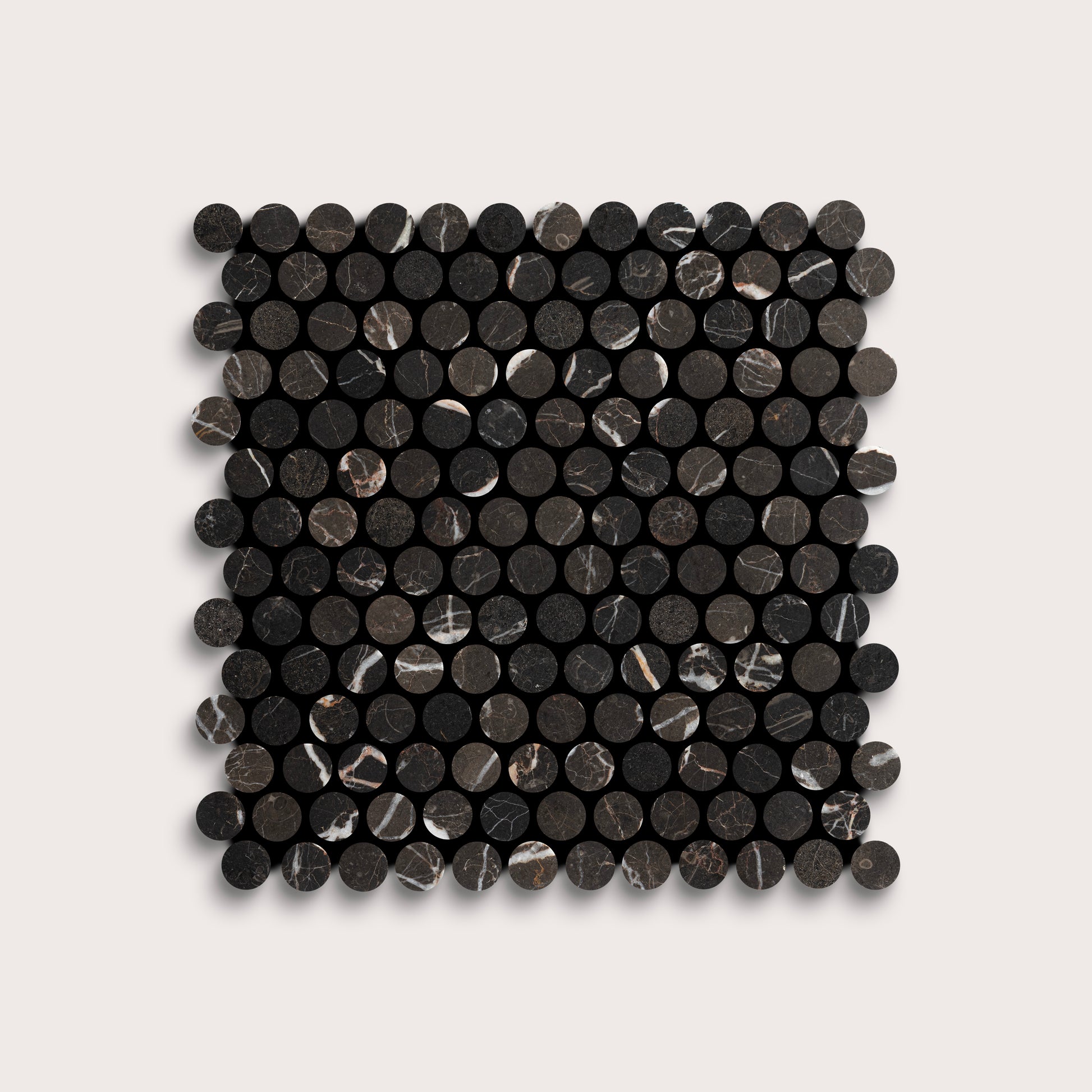 Square arrangement of black circular marble tiles on a light gray background