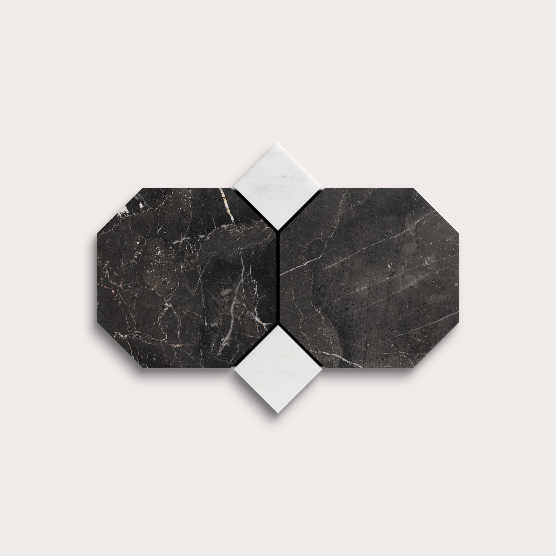 Hexagonal black marble tiles with white grout on a light gray background