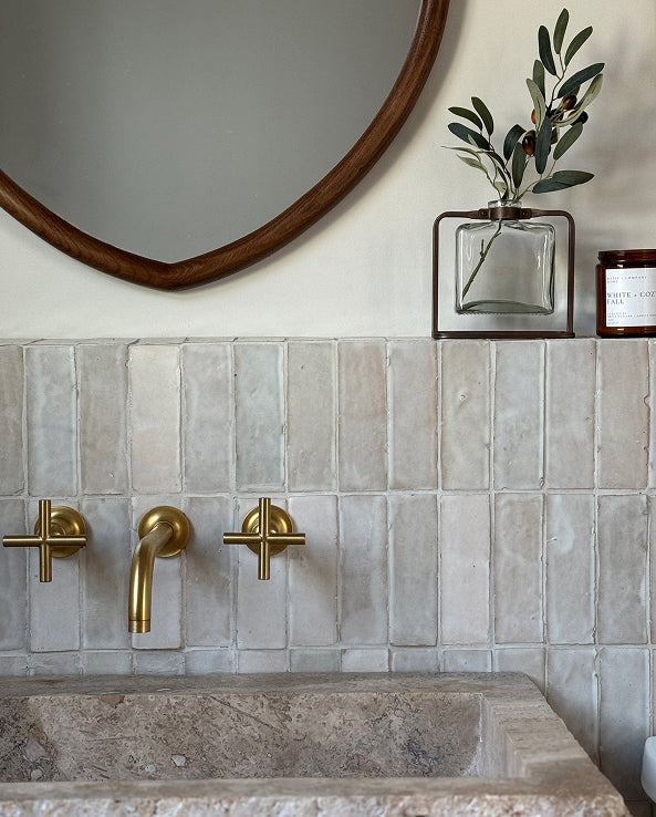 white zellige tile on backsplash in bathroom