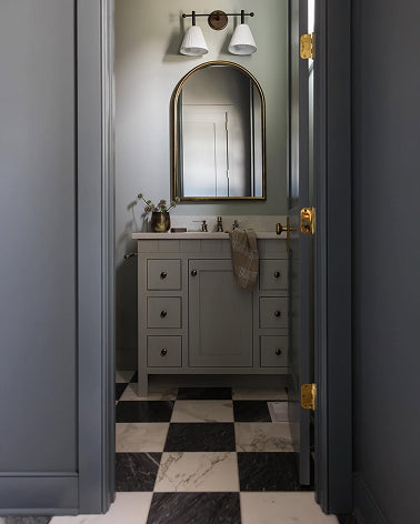 moody bathroom with marble checkerboard flooring