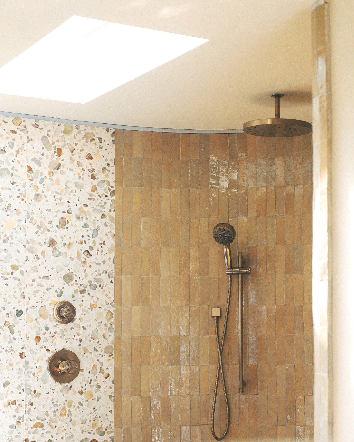 Feel that? Set the mood, then build the room. Warm tones, tactile surfaces and a little shine take it from feeling to fully realized.

Tile: Glazed Clay 2x6 Thin Bejmat Zellige Tile, Rolling Stone 24x24 Venezia Terrazzo Tile
Design/Photo: @villastino (image 3)