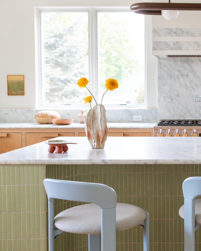 The best gathering spaces give you a reason to linger. Here, a custom Getty Green ceramic mosaic brings color, rhythm and a little personality to the kitchen island.

Interested in going custom? Contact us for options, pricing and lead times.

Tile: Custom Getty Green 1x6 Ceramic Mosaic Matte
Design: @klhcustomhomes
Photo: @kvterob