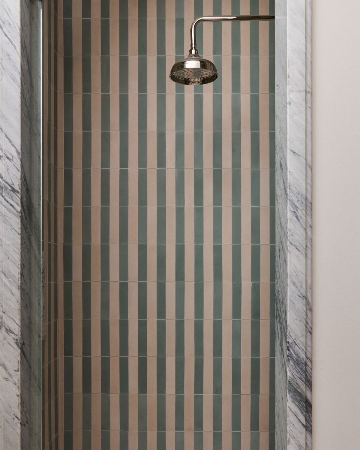 The right colors don't compete. They conspire. Soft Sea Foam meets warm Putty to create a simple repeat that feels anything but expected.

Tile: Sea Foam 2x8 Cement, Putty 2x8 Cement
Design: @me.development 
Photo: @yanglincphoto