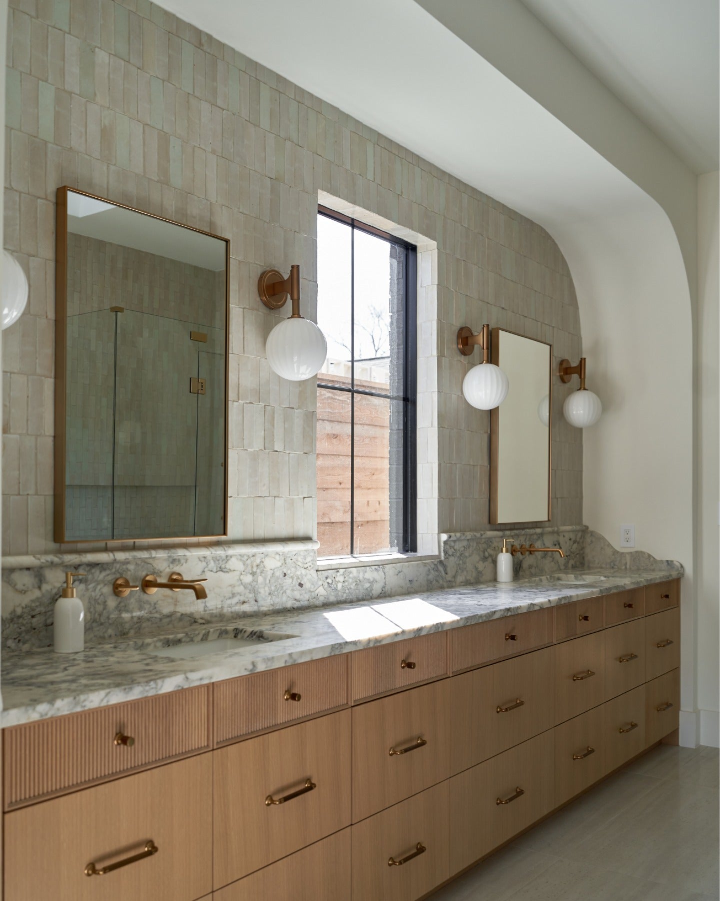 Beautiful homes begin with a shared vision.

Thoughtful architecture, timeless lighting, handcrafted tile, and natural stone carry a quiet sense of continuity from the primary bath to the kitchen, butler's pantry, and laundry room, creating a home that feels beautifully whole.

Created in collaboration with @buildtx and @rejuvenation. (image 4)