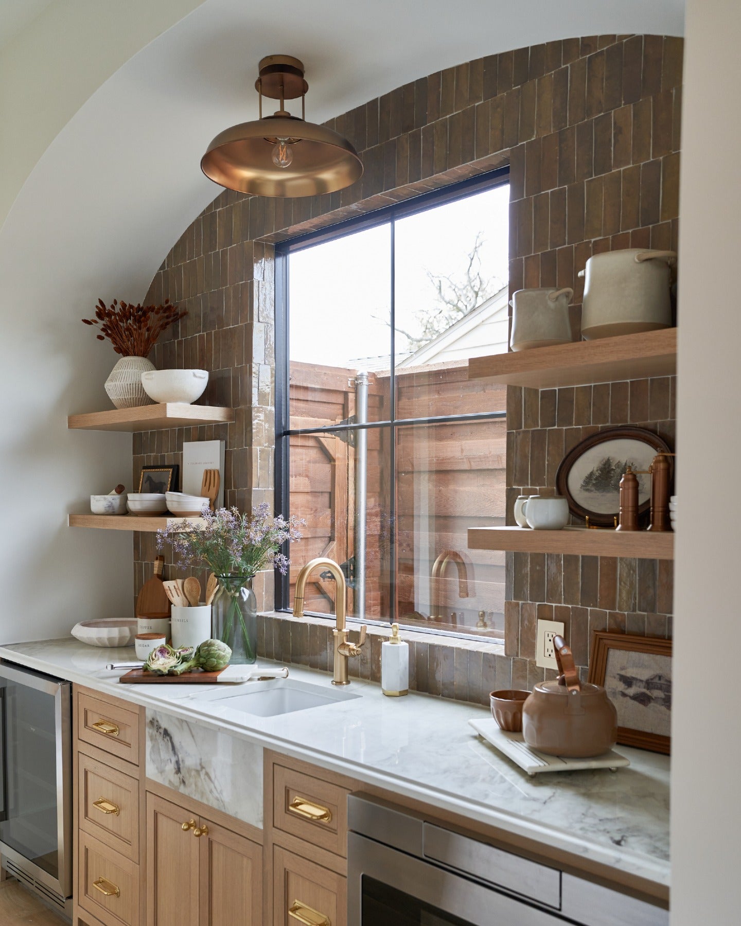 Beautiful homes begin with a shared vision.

Thoughtful architecture, timeless lighting, handcrafted tile, and natural stone carry a quiet sense of continuity from the primary bath to the kitchen, butler's pantry, and laundry room, creating a home that feels beautifully whole.

Created in collaboration with @buildtx and @rejuvenation. (image 6)
