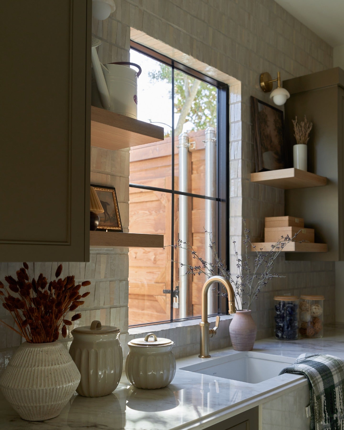 Beautiful homes begin with a shared vision.

Thoughtful architecture, timeless lighting, handcrafted tile, and natural stone carry a quiet sense of continuity from the primary bath to the kitchen, butler's pantry, and laundry room, creating a home that feels beautifully whole.

Created in collaboration with @buildtx and @rejuvenation. (image 8)