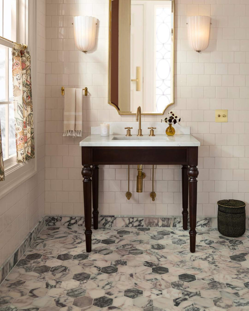 Small space, big marble energy. Calacatta Viola Hexagon Mosaic makes a convincing case for going bold underfoot.

Tile: Calacatta Viola 2 Inch Hexagon Mosaic Marble Tile | Honed
Image Source: @rejuvenation