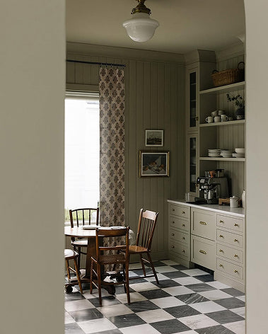 kitchen with table and marble checkerboard flooring