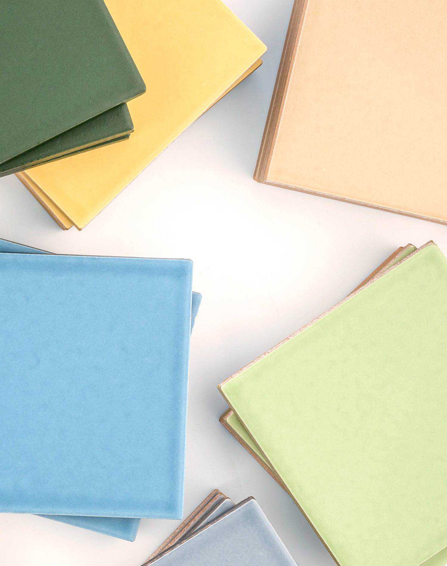 Colorful ceramic tile arranged on a white surface