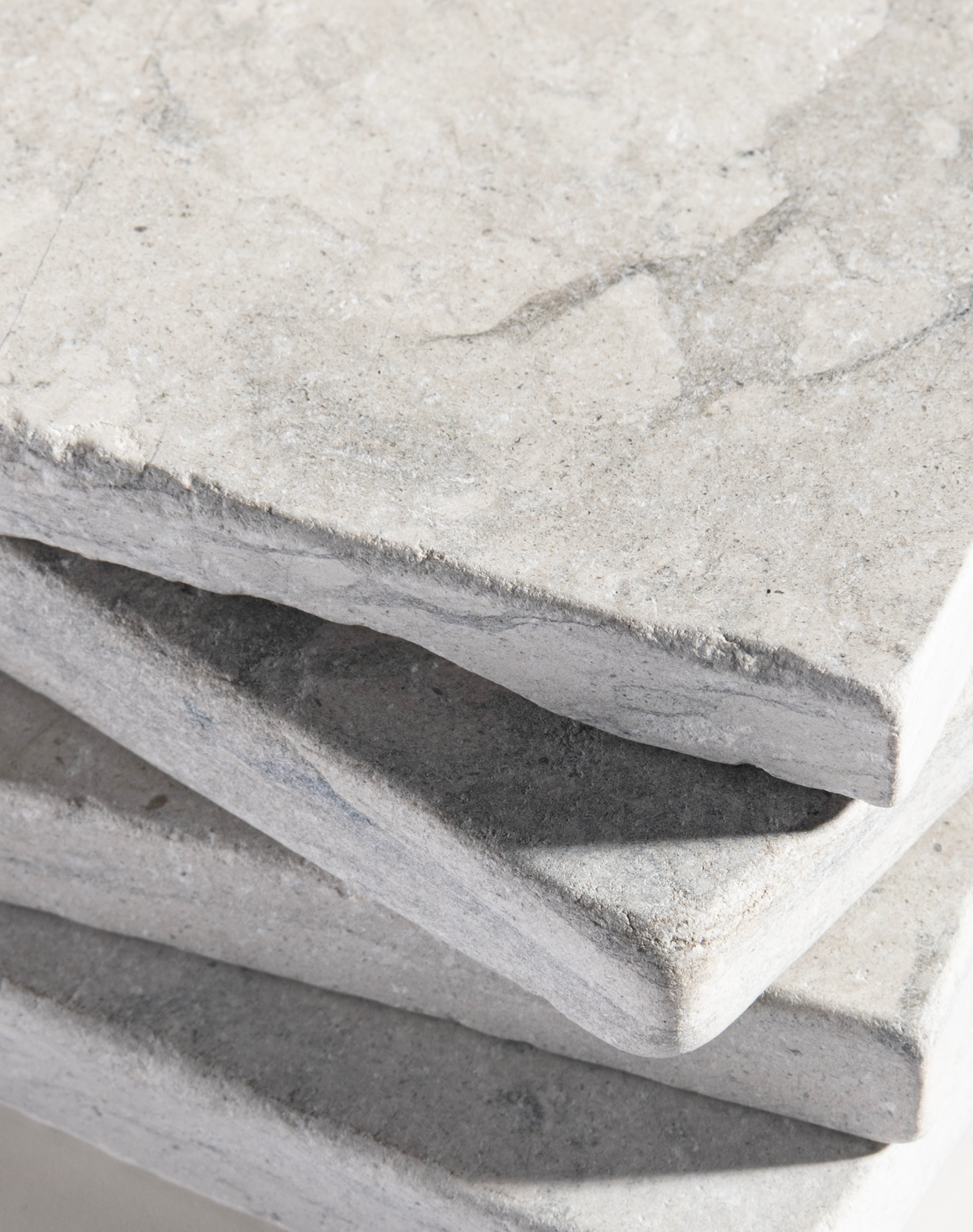 Close-up of gray limestone tiles with a slight texture